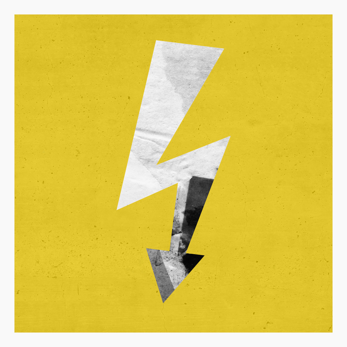 Spark of Inspiration. Lightning bolt made out of graffiti paper on yellow concrete wall.